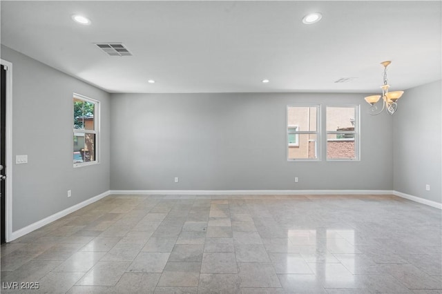 unfurnished room featuring a notable chandelier, recessed lighting, visible vents, and baseboards