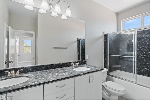 full bathroom with toilet, a sink, and a healthy amount of sunlight