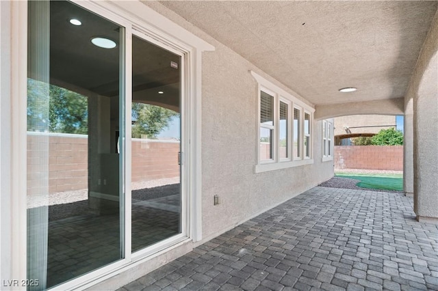 view of patio featuring fence
