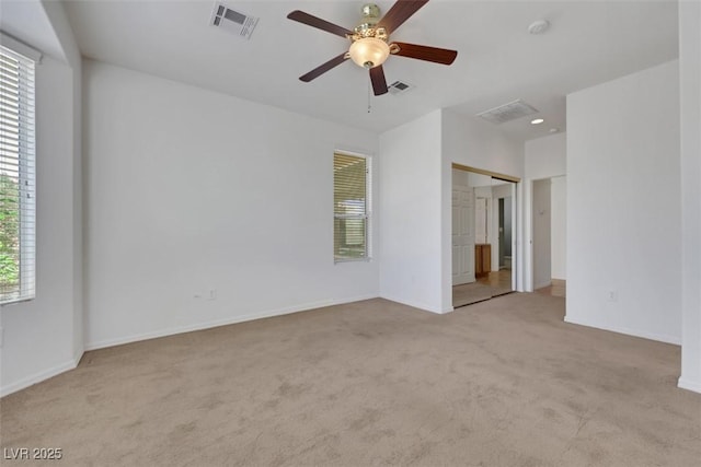 unfurnished bedroom with visible vents, carpet flooring, and baseboards