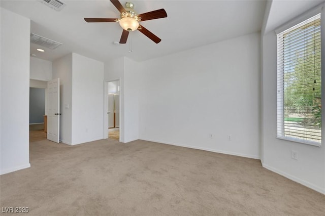 unfurnished bedroom with baseboards, visible vents, a ceiling fan, and carpet floors