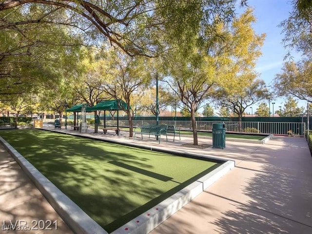 view of property's community featuring fence