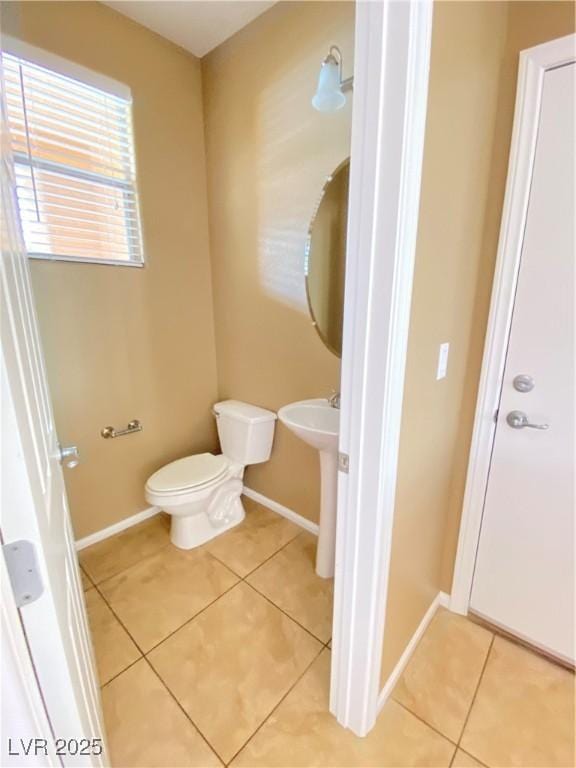 10349 Mystic Pine Rd, Las Vegas, NV 89135 - bathroom with tile patterned flooring, baseboards, and toilet