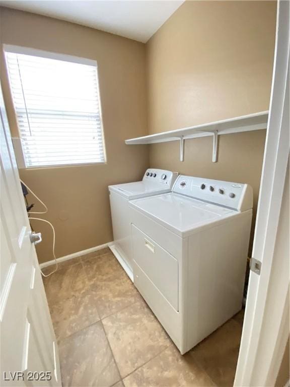 10349 Mystic Pine Rd, Las Vegas, NV 89135 - laundry room featuring washer and dryer, light tile patterned floors, and baseboards