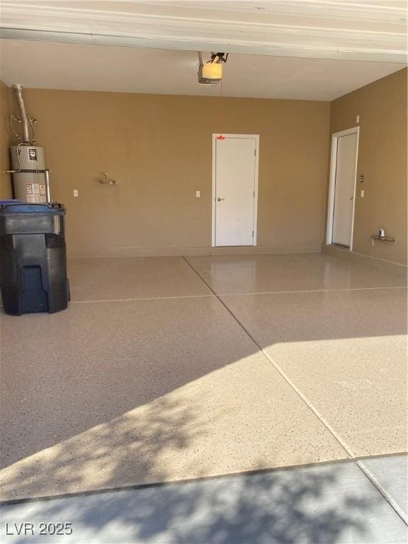 10349 Mystic Pine Rd, Las Vegas, NV 89135 - garage featuring secured water heater and a garage door opener