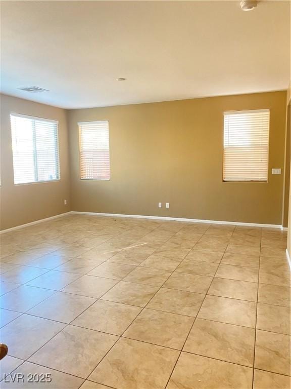 10349 Mystic Pine Rd, Las Vegas, NV 89135 - spare room with light tile patterned floors and baseboards