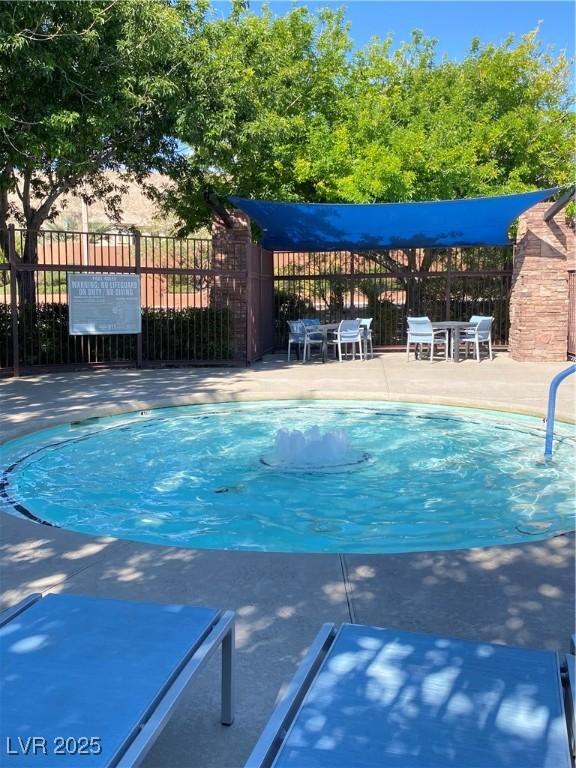 10349 Mystic Pine Rd, Las Vegas, NV 89135 - view of swimming pool featuring fence and a patio area