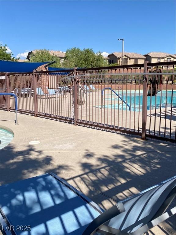 10349 Mystic Pine Rd, Las Vegas, NV 89135 - community pool featuring fence and a patio