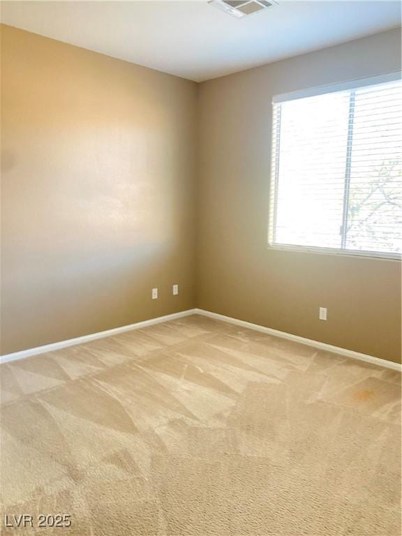 10349 Mystic Pine Rd, Las Vegas, NV 89135 - spare room featuring baseboards and light carpet