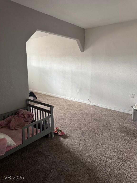 4834 E Van Buren Ave, Las Vegas, NV 89110 - carpeted bedroom featuring baseboards