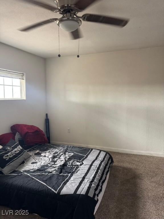 4834 E Van Buren Ave, Las Vegas, NV 89110 - carpeted bedroom with a ceiling fan and baseboards