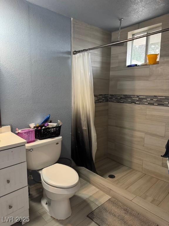 4834 E Van Buren Ave, Las Vegas, NV 89110 - full bath with toilet, a shower stall, and vanity