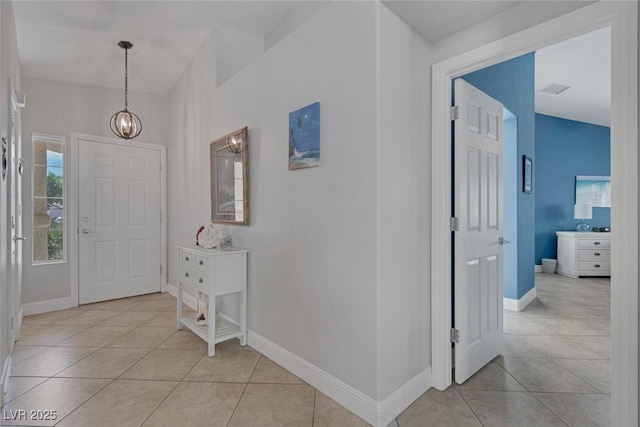 5205 Molveno Ct, Las Vegas, NV 89130 - foyer entrance featuring light tile patterned flooring and a chandelier