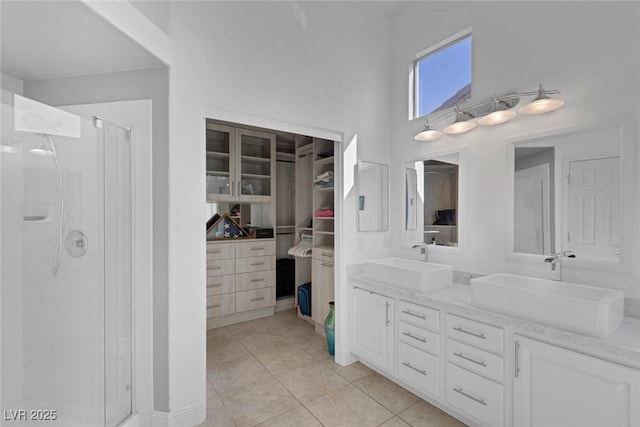 5205 Molveno Ct, Las Vegas, NV 89130 - full bathroom with a shower stall, double vanity, tile patterned flooring, and a high ceiling