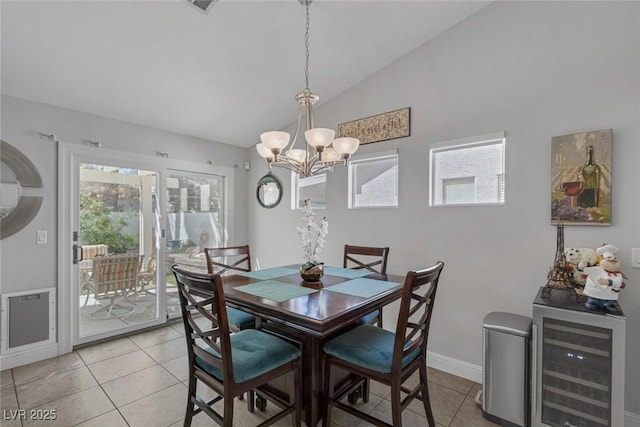 5205 Molveno Ct, Las Vegas, NV 89130 - dining room featuring wine cooler, light tile patterned flooring, plenty of natural light, a chandelier, and lofted ceiling