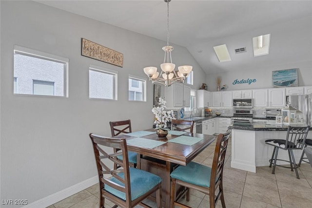 5205 Molveno Ct, Las Vegas, NV 89130 - dining space featuring a chandelier, light tile patterned floors, and high vaulted ceiling
