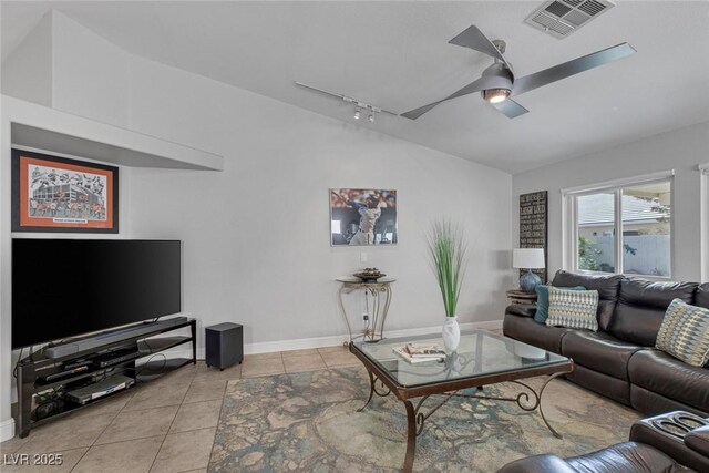 5205 Molveno Ct, Las Vegas, NV 89130 - living room with light tile patterned flooring, lofted ceiling, a ceiling fan, and rail lighting