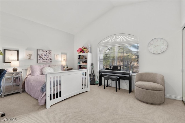 carpeted bedroom featuring high vaulted ceiling and baseboards
