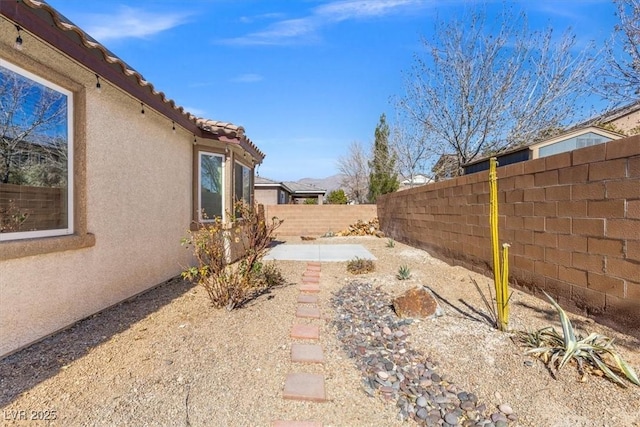 8140 Redbud Vine St, North Las Vegas, NV 89085 - view of yard featuring a patio and a fenced backyard