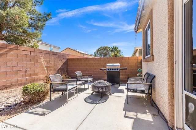 8140 Redbud Vine St, North Las Vegas, NV 89085 - view of patio / terrace featuring fence, a fire pit, and grilling area
