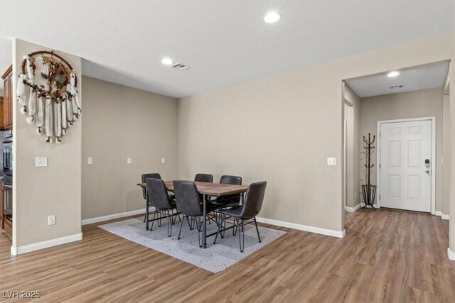 8140 Redbud Vine St, North Las Vegas, NV 89085 - dining room featuring baseboards, recessed lighting, wood finished floors, and visible vents