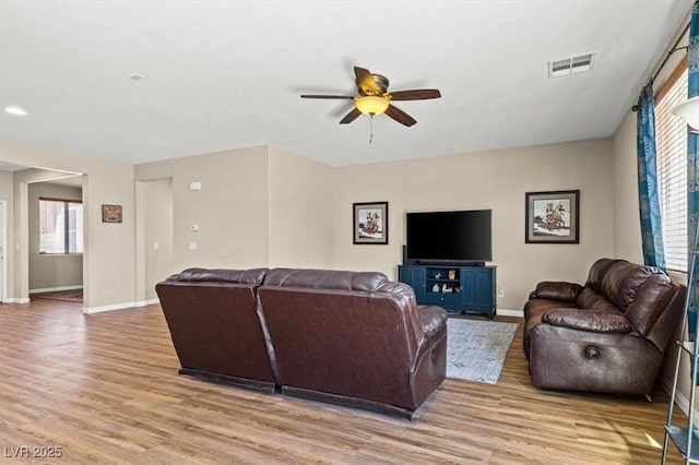 8140 Redbud Vine St, North Las Vegas, NV 89085 - living area featuring baseboards, visible vents, ceiling fan, and light wood finished floors