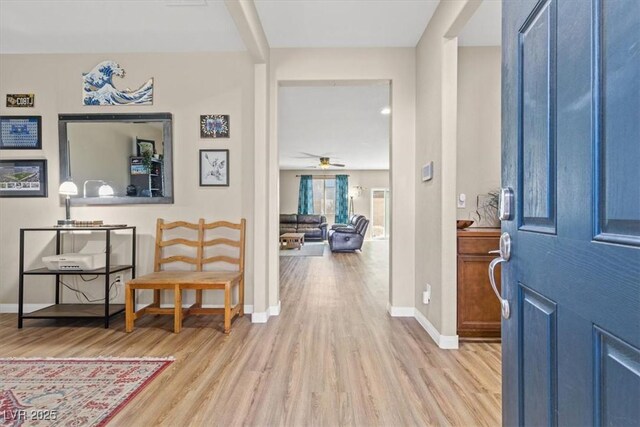 8140 Redbud Vine St, North Las Vegas, NV 89085 - foyer with ceiling fan, light wood-style flooring, and baseboards
