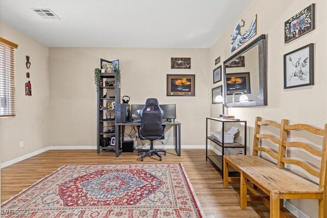 8140 Redbud Vine St, North Las Vegas, NV 89085 - office space with wood finished floors, visible vents, and baseboards
