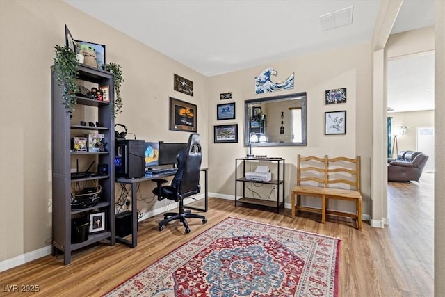 8140 Redbud Vine St, North Las Vegas, NV 89085 - home office with wood finished floors, visible vents, and baseboards