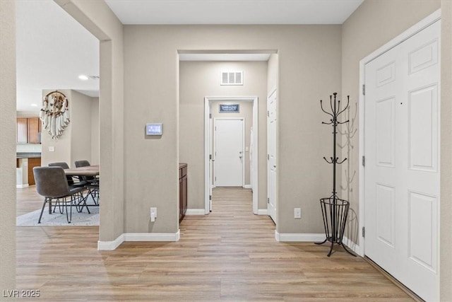 8140 Redbud Vine St, North Las Vegas, NV 89085 - entrance foyer featuring baseboards, visible vents, and light wood-style floors
