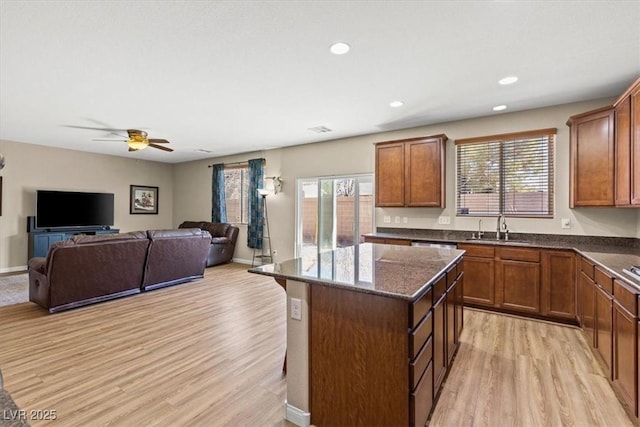 8140 Redbud Vine St, North Las Vegas, NV 89085 - kitchen with a center island, a sink, a wealth of natural light, and light wood-style floors