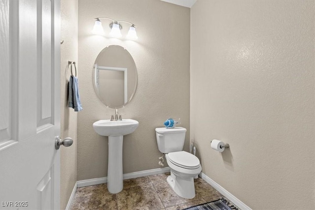 8140 Redbud Vine St, North Las Vegas, NV 89085 - half bath with toilet, tile patterned flooring, and baseboards
