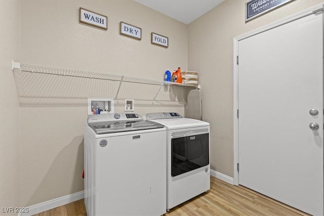 8140 Redbud Vine St, North Las Vegas, NV 89085 - laundry area featuring light wood finished floors, baseboards, laundry area, and washer and clothes dryer