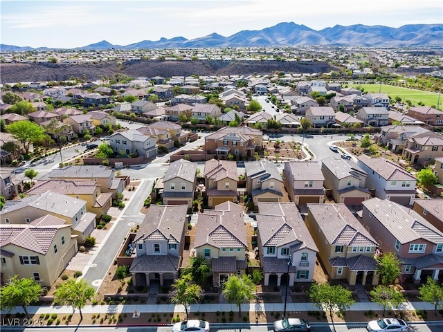 birds eye view of property with a residential view and a mountain view
