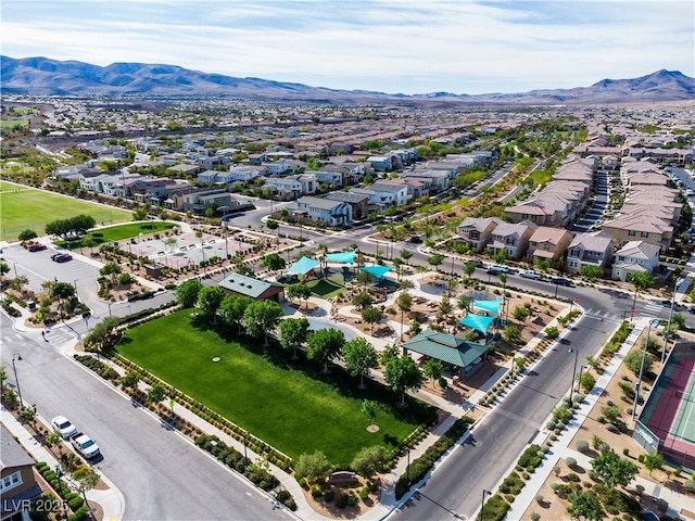 birds eye view of property with a mountain view and a residential view