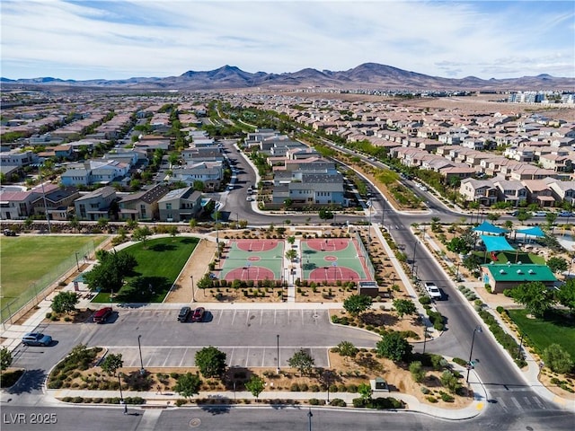 drone / aerial view featuring a residential view and a mountain view