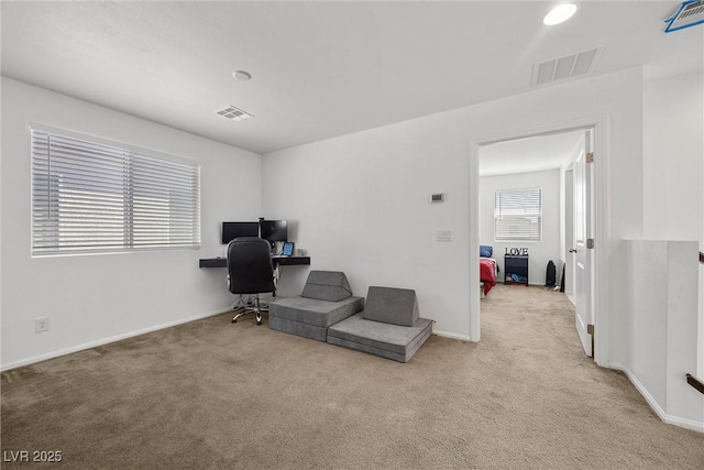 office space featuring visible vents, carpet, and baseboards