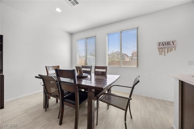 dining area with recessed lighting, baseboards, visible vents, and light wood-type flooring
