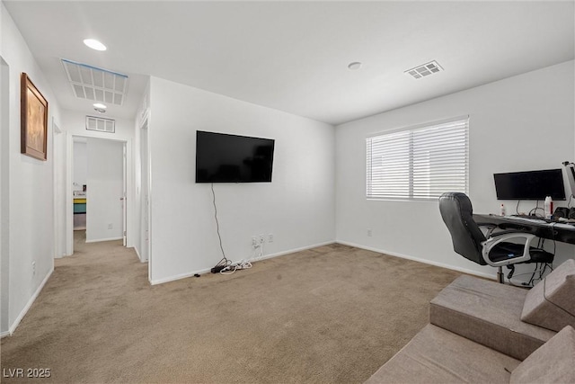 home office featuring light colored carpet, baseboards, and visible vents
