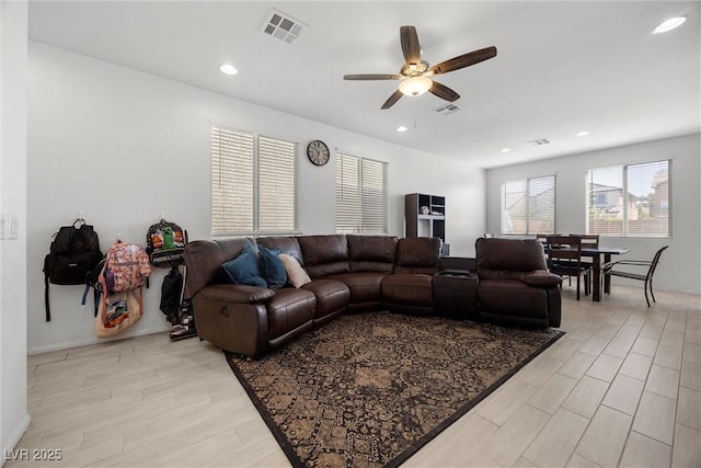 living area featuring visible vents, recessed lighting, and ceiling fan