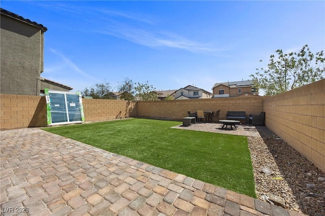 view of yard with a patio and a fenced backyard