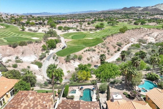 aerial view featuring a mountain view, a residential view, and view of golf course