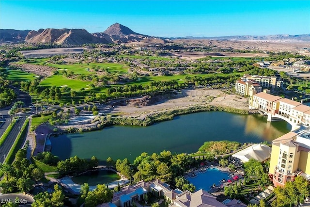 birds eye view of property with a water and mountain view