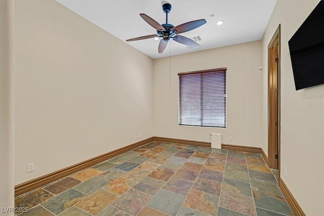 unfurnished room with baseboards, recessed lighting, ceiling fan, and stone tile flooring