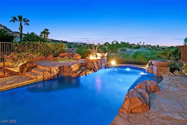 view of swimming pool featuring fence and a fenced in pool