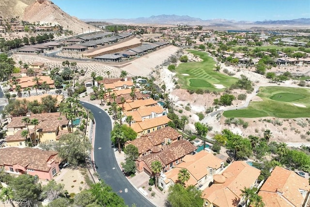 aerial view featuring a mountain view, a residential view, and view of golf course