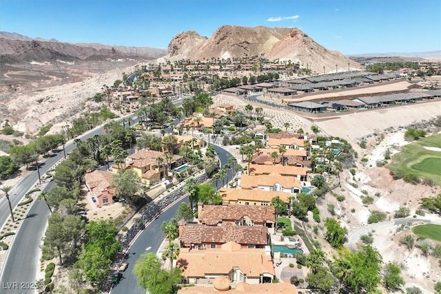 aerial view with a residential view, a mountain view, and view of golf course