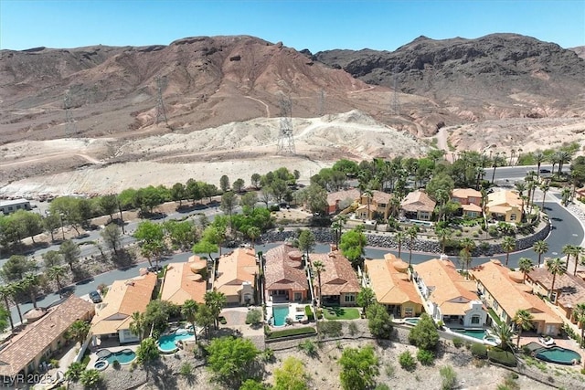 drone / aerial view with a residential view and a mountain view