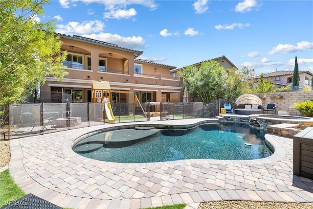 12254 Cape Cortez Ct, Las Vegas, NV 89138 - view of pool featuring a fenced backyard, a pool with connected hot tub, and a patio area