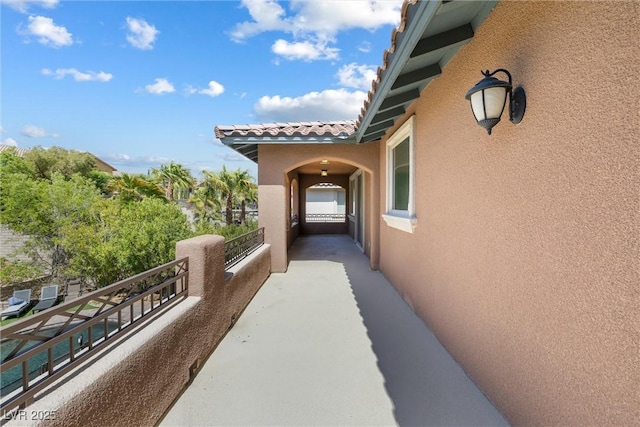 12254 Cape Cortez Ct, Las Vegas, NV 89138 - view of side of property with stucco siding, a balcony, and a tiled roof